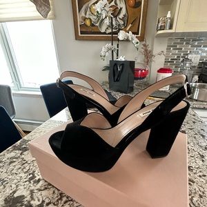 Black platform Miu miu sandals.